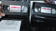 Load image into Gallery viewer, Terrifier 1, 2 &amp; 3 VHS Tapes NEW Official Releases Broke Horror Fan 2 Clamshell 1 Slip Case

